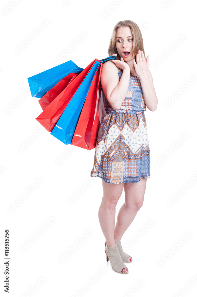 Sales and discount concept with shocked pretty female doing shop Sales and discount concept with shocked pretty female doing shop