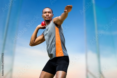 sportsman practising shot put  photo