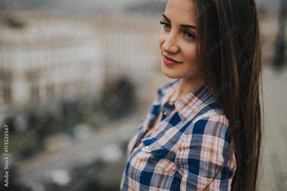 Young cute smiling lady posing in a beautiful city, italy, near ocean and mountains
