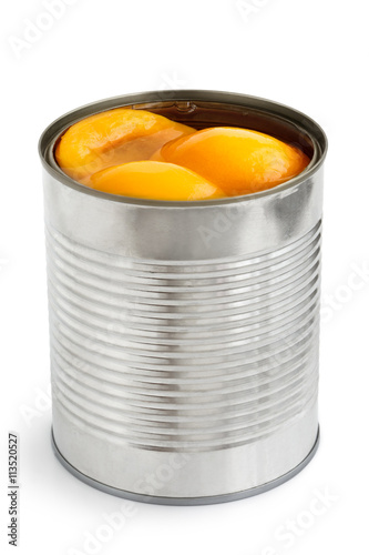 Open can of peach halves in syrup in perspective. Isolated on wh