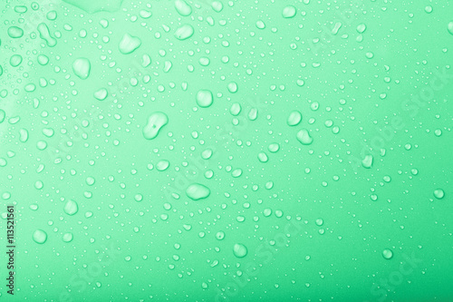 Drops of water on a color background. Green. Selective focus. To