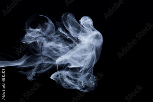 Cloud of smoke on black background. Selective focus © strannik_fox