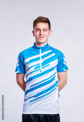 Wallpaper Mural Boy in striped sports t-shirt, young man, studio shot Torontodigital.ca