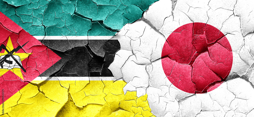 Mozambique flag with Japan flag on a grunge cracked wall