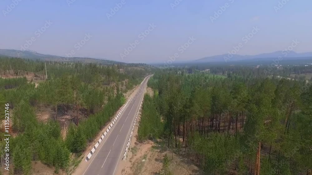Aerial View Road In The Coniferous Forest On Lake Baikal, Buryatia, Russia Aerial View Road In The Coniferous Forest On Lake Baikal, Buryatia, Russia