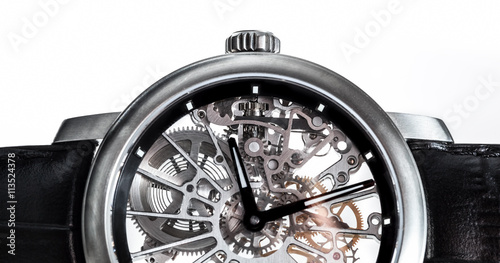 Elegant watch with visible mechanism, clockwork close-up.
