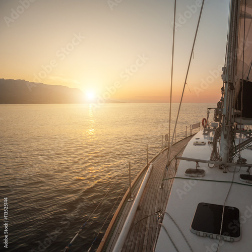 Dawn on a yacht at sea. © Anton Pedko