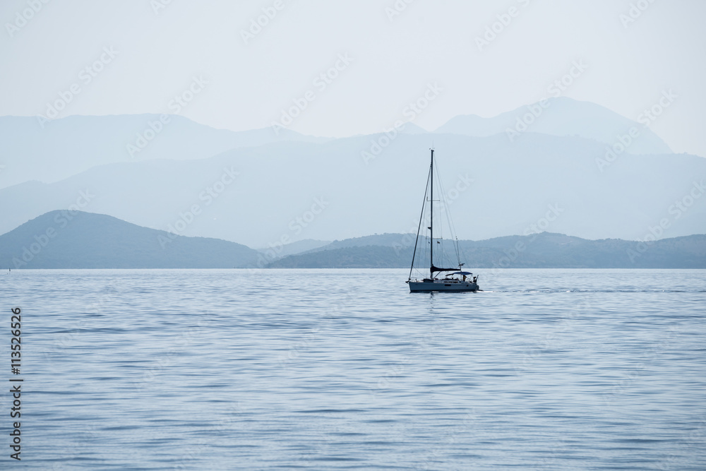 Sailing boat in the morning in Corfu, Greece Sailing boat in the morning in Corfu, Greece