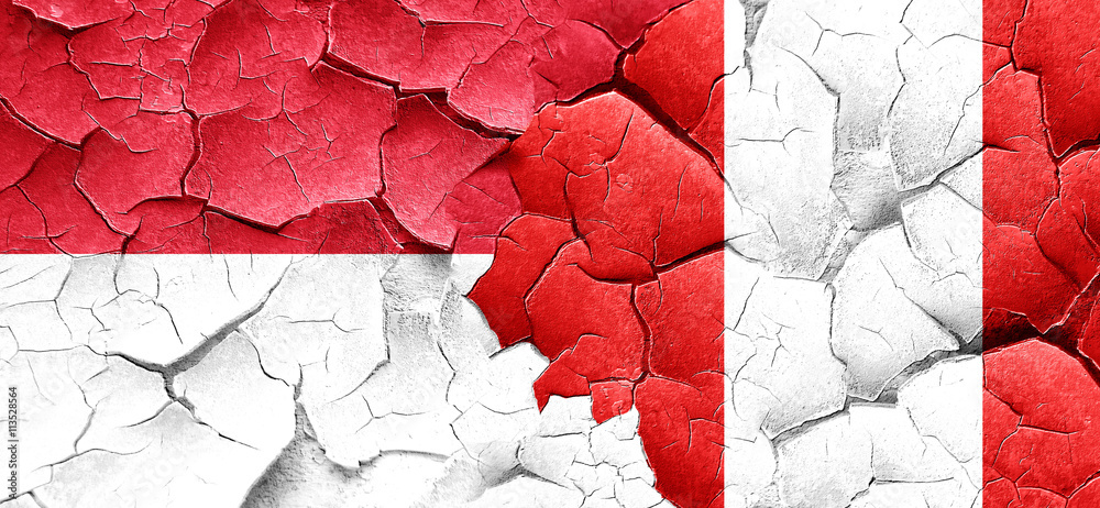 monaco flag with Peru flag on a grunge cracked wall