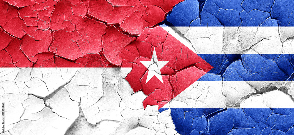 monaco flag with cuba flag on a grunge cracked wall monaco flag with cuba flag on a grunge cracked wall