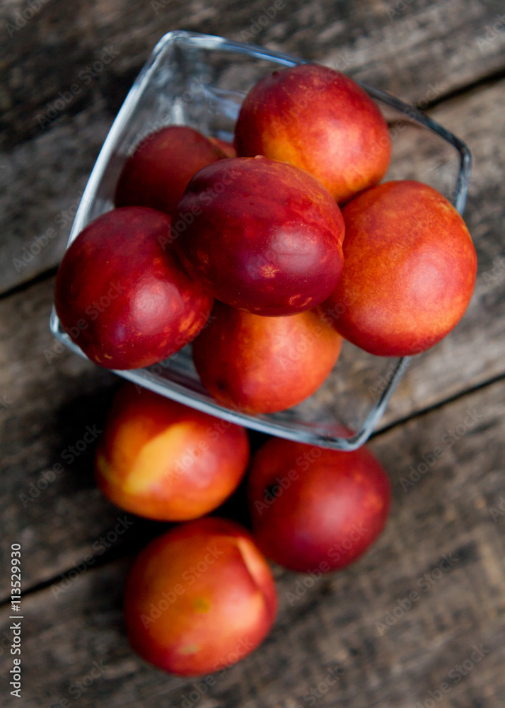 The simple food composition with nectarines on the unique backing closeup The simple food composition with nectarines on the unique backing closeup
