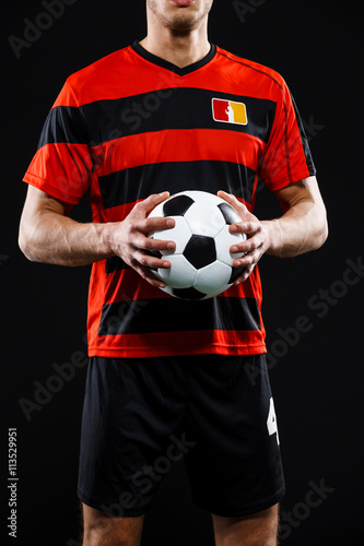 Close up of athlete with soccer ball © Cookie Studio