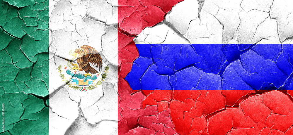 mexico flag with Russia flag on a grunge cracked wall