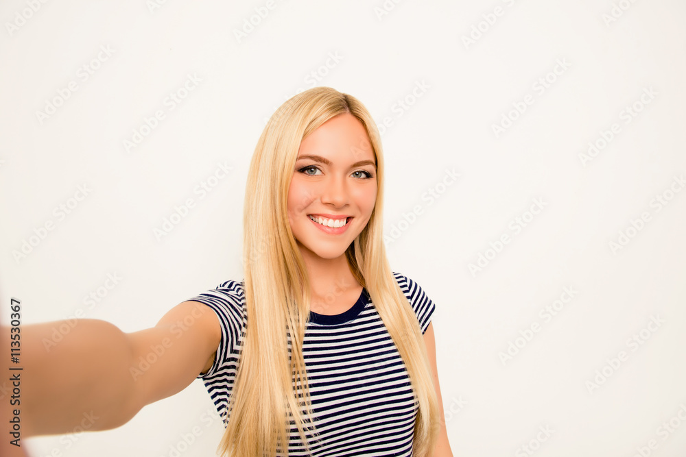 Pretty young woman making selfie on white background Pretty young woman making selfie on white background