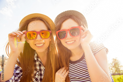 Portrait of beautiful girls with beamings smiles wearing spectac