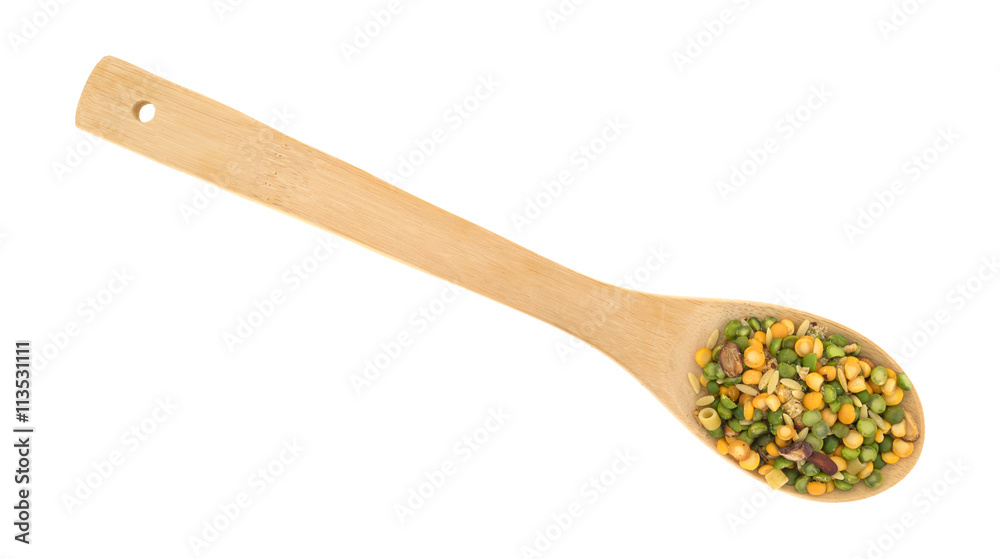Minestrone soup mix in a spoon on a white background.