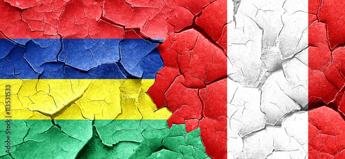 Mauritius flag with Peru flag on a grunge cracked wall