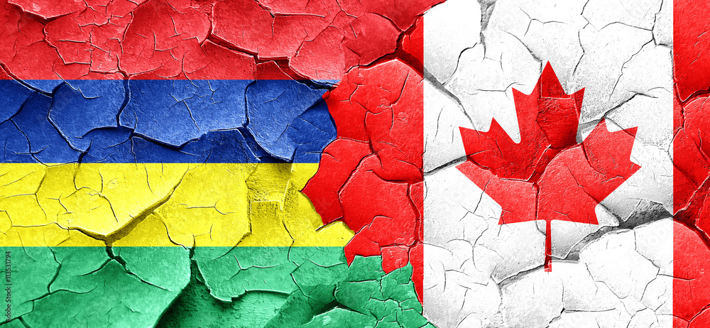 Mauritius flag with Canada flag on a grunge cracked wall