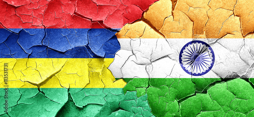 Mauritius flag with India flag on a grunge cracked wall