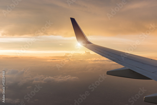 Wing aircraft at cloud sunset