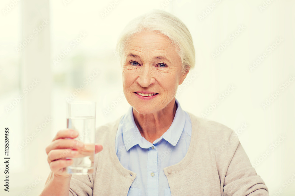 happy senior woman with glass of water at home happy senior woman with glass of water at home