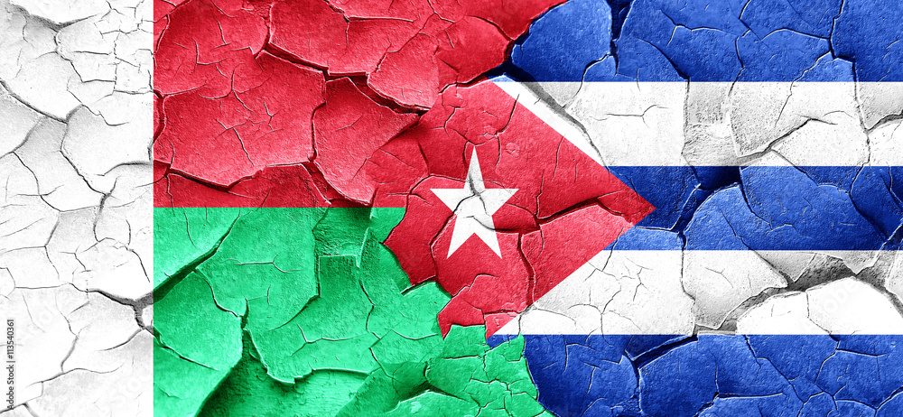 Madagascar flag with cuba flag on a grunge cracked wall