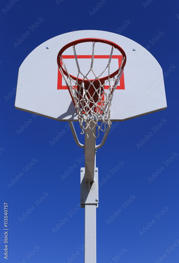 
Basketball basket on blue sky background. 
durable mesh.
