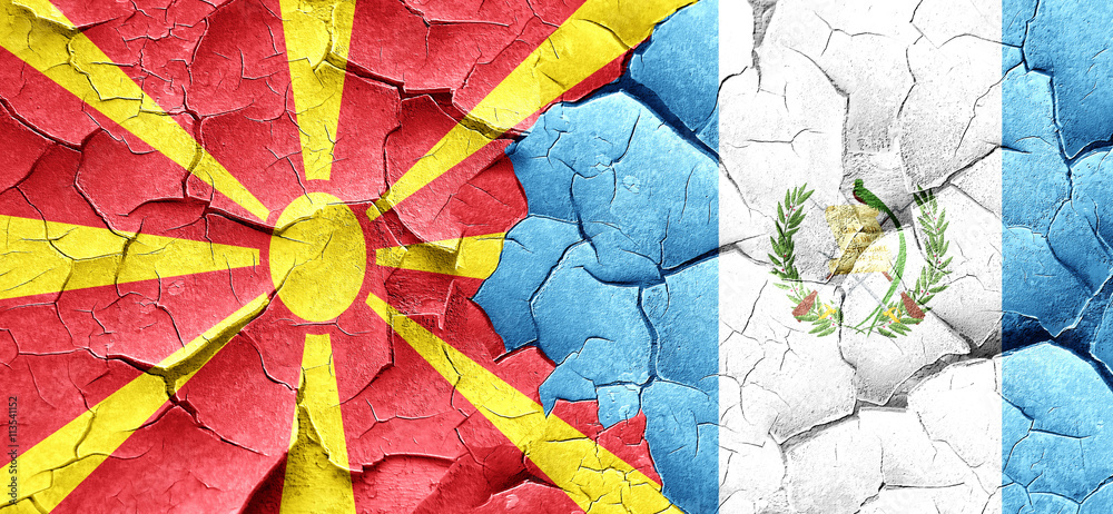 Macedonia flag with Guatemala flag on a grunge cracked wall
