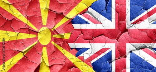 Macedonia flag with Great Britain flag on a grunge cracked wall