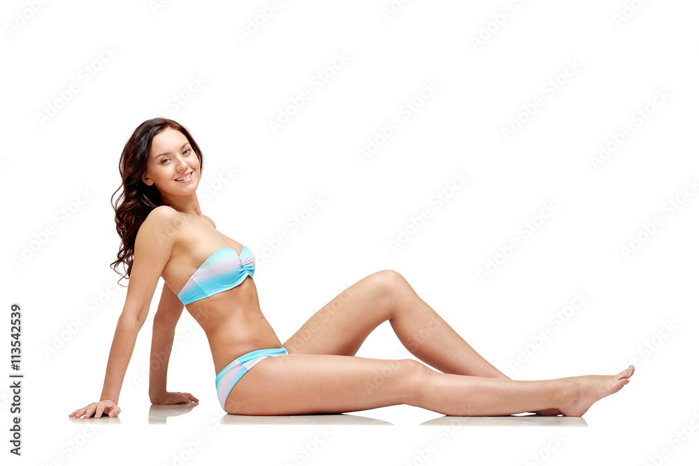 happy young woman sunbathing in bikini swimsuit