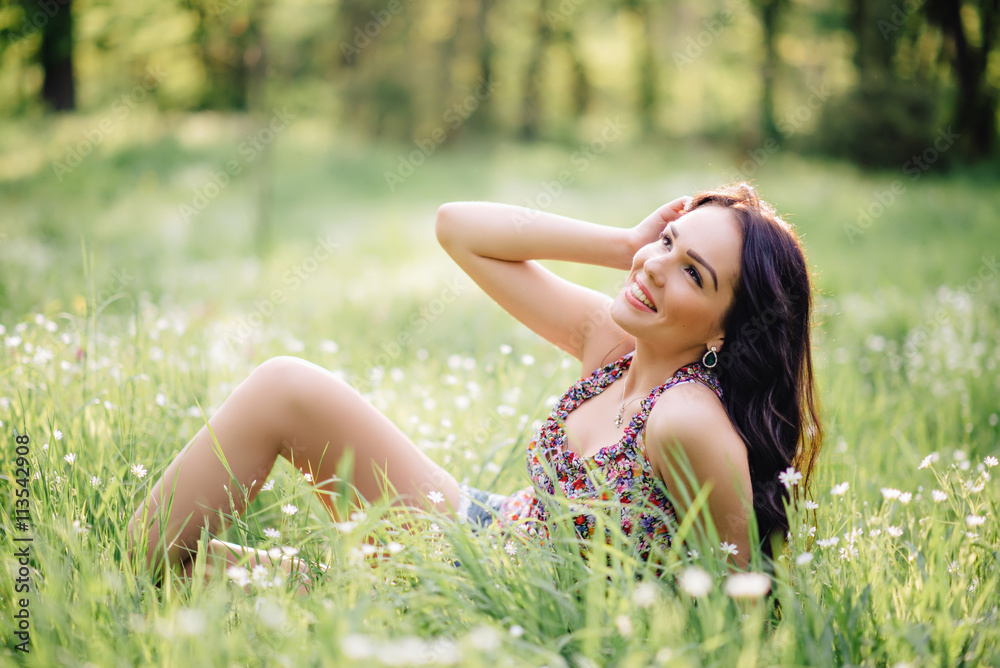 sunny summer day, a beautiful young woman lying on the grass sunny summer day, a beautiful young woman lying on the grass
