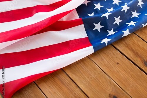 Fototapeta Naklejka Na Ścianę i Meble -  close up of american flag on wooden boards