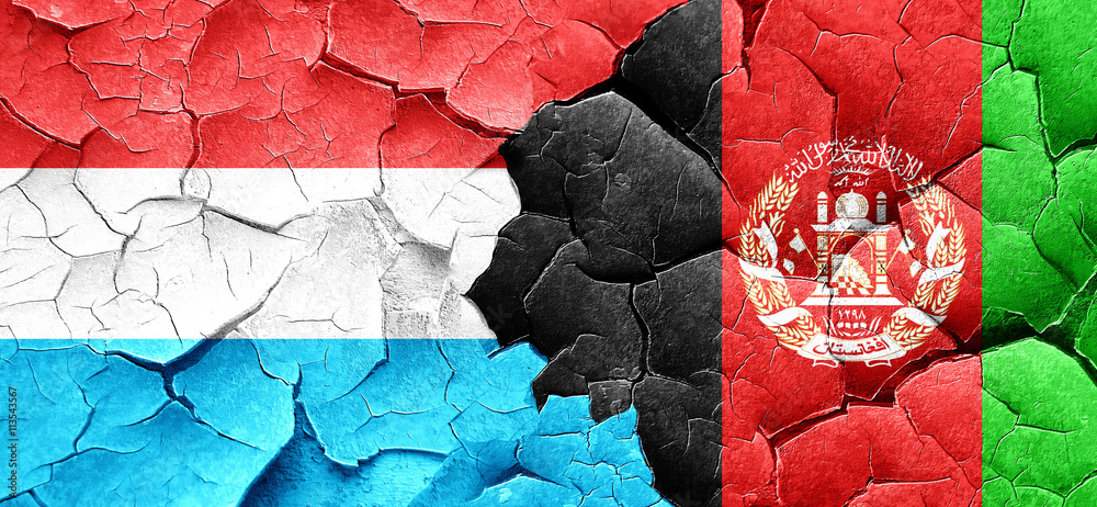 Luxembourg flag with afghanistan flag on a grunge cracked wall
