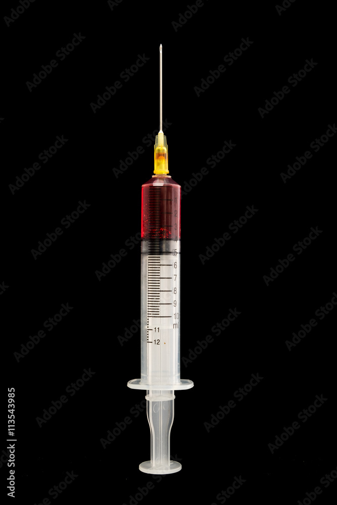 Syringe with blood on a black background Syringe with blood on a black background