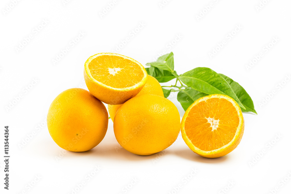 Fototapeta premium Fresh oranges isolated with leafs on white background