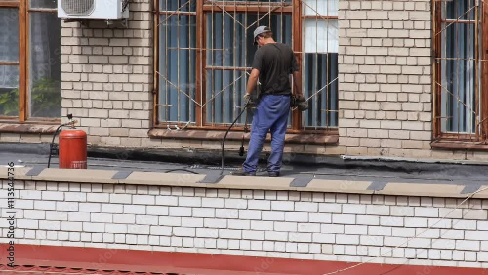 custom made wallpaper toronto digitalYoung caucasian man repairing leaking roof layer. Installing asphalt strip. Gas burner. Flame.