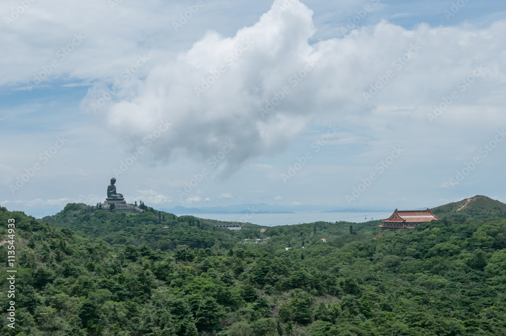 Tian Tan Buddha aka the Big Buddha is a large bronze statue of a Sakyamuni Buddha at Ngong Ping Tian Tan Buddha aka the Big Buddha is a large bronze statue of a Sakyamuni Buddha at Ngong Ping