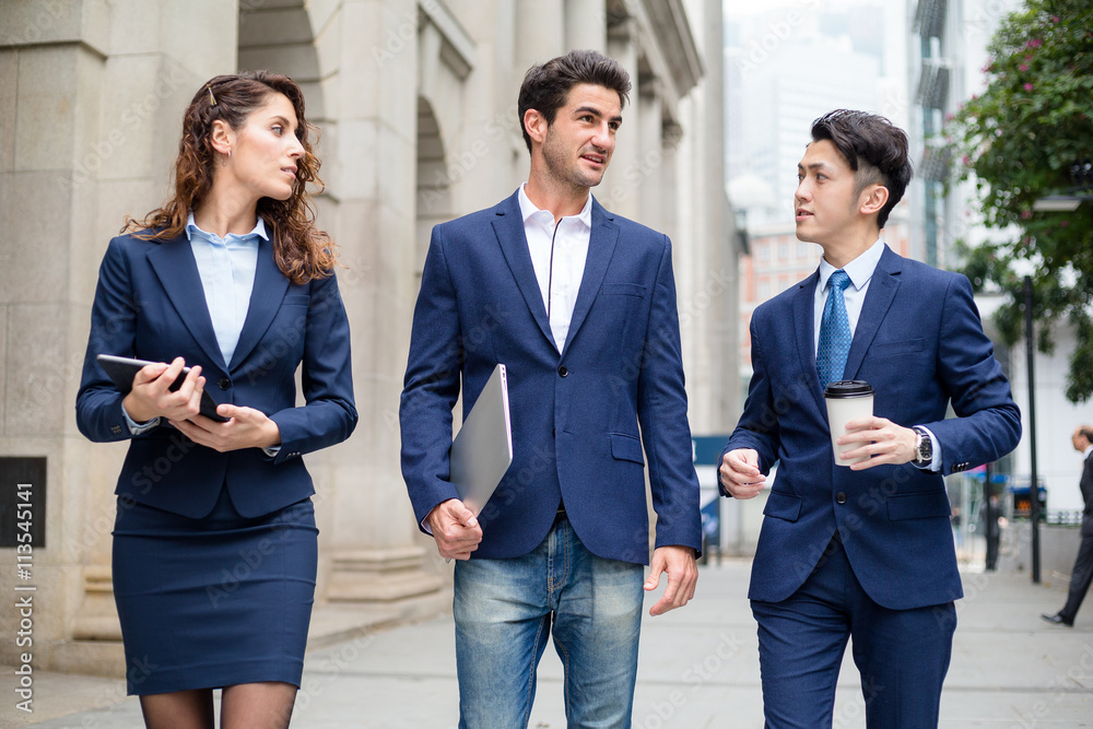 Group of business people walking at outdoor Group of business people walking at outdoor