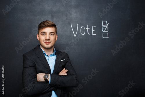 picture of suited man near text vote