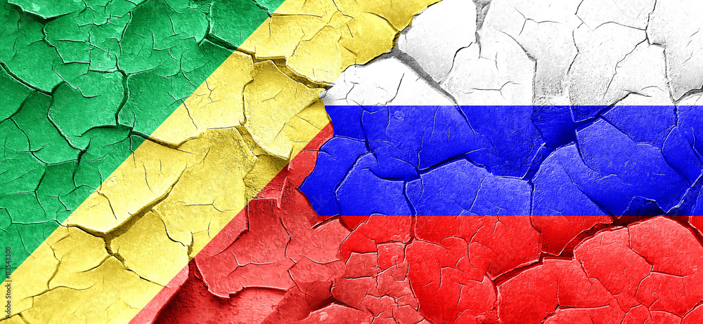 Congo flag with Russia flag on a grunge cracked wall