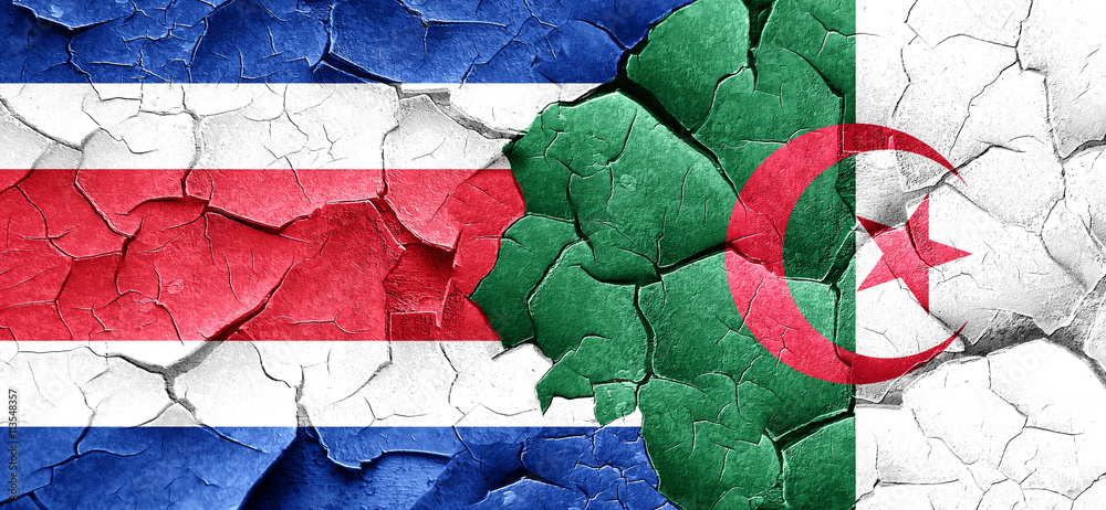 Costa Rica flag with Algeria flag on a grunge cracked wall Costa Rica flag with Algeria flag on a grunge cracked wall