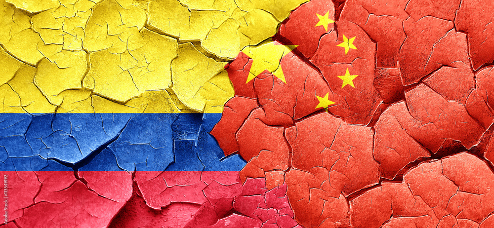 Colombia flag with China flag on a grunge cracked wall Colombia flag with China flag on a grunge cracked wall