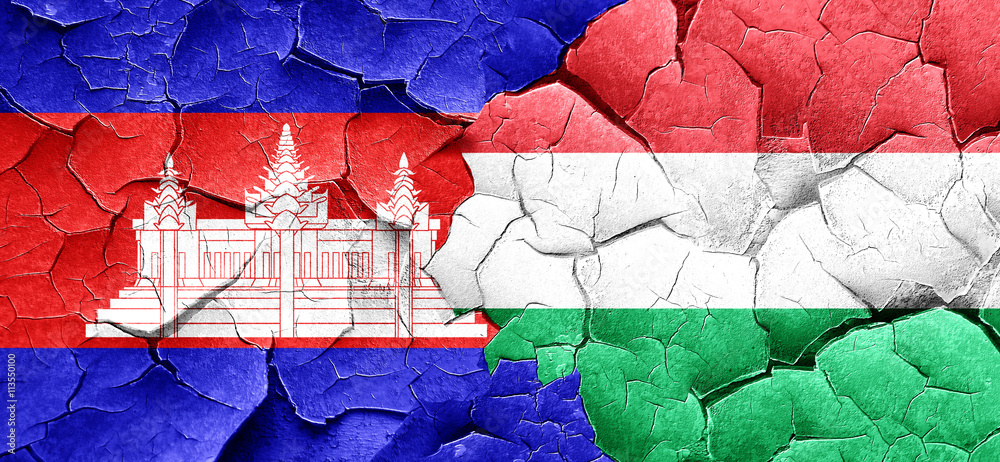 Cambodia flag with Hungary flag on a grunge cracked wall