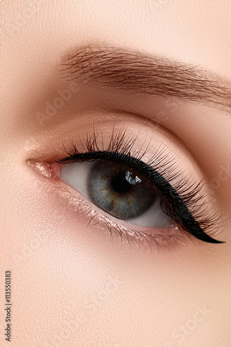 Macro shot of woman's beautiful eye with extremely long eyelashe