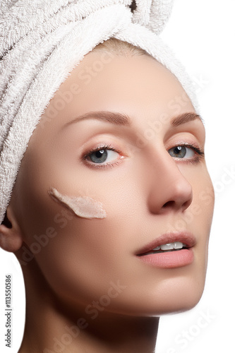 Beautiful face of young woman with clean fresh skin. Portrait of