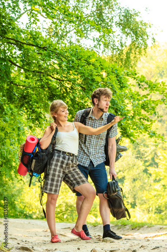 Hiking young couple with guitar backpack outdoor © anetlanda