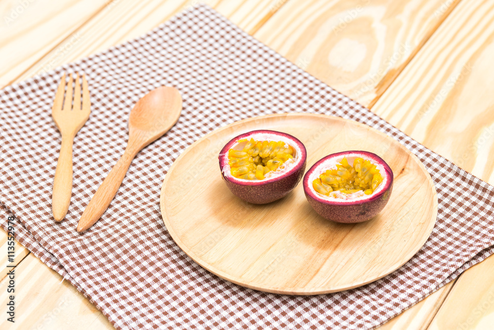 Passion fruit on wood table