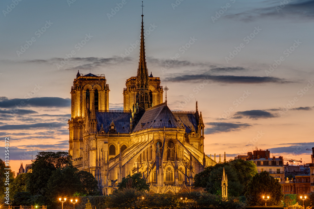 The backside of the famous Notre Dame cathedral in Paris at dawn