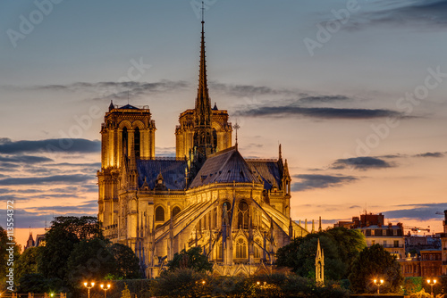 The backside of the famous Notre Dame cathedral in Paris at dawn