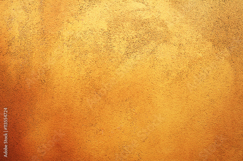 Яркий светлый оранжевый фактурный абстрактный фон стены
